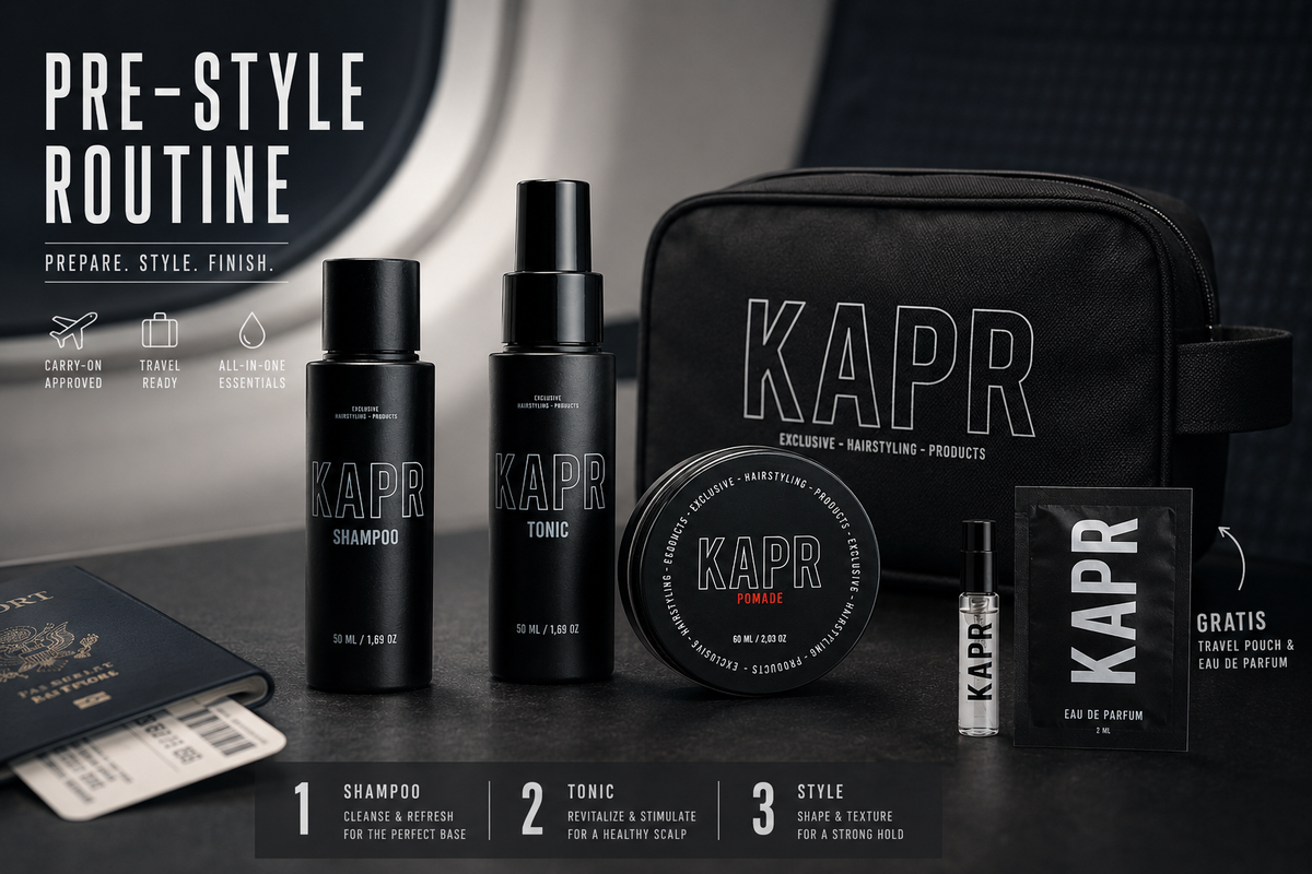 KAPR travel kit Pomade op donkere achtergrond: Shampoo, Tonic, Pomade, toilettas en eau de parfum tester
