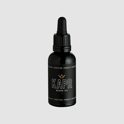 KAPR Beard Oil – elegante zwarte flacon met gouden details.