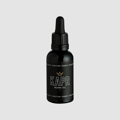 KAPR Beard Oil – elegante zwarte flacon met gouden details.