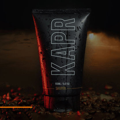 KAPR Shaper – zwarte tube met glanseffect en rood licht, modern productdesign.