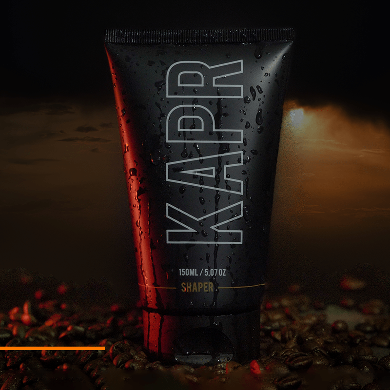 KAPR Shaper – zwarte tube met glanseffect en rood licht, modern productdesign.
